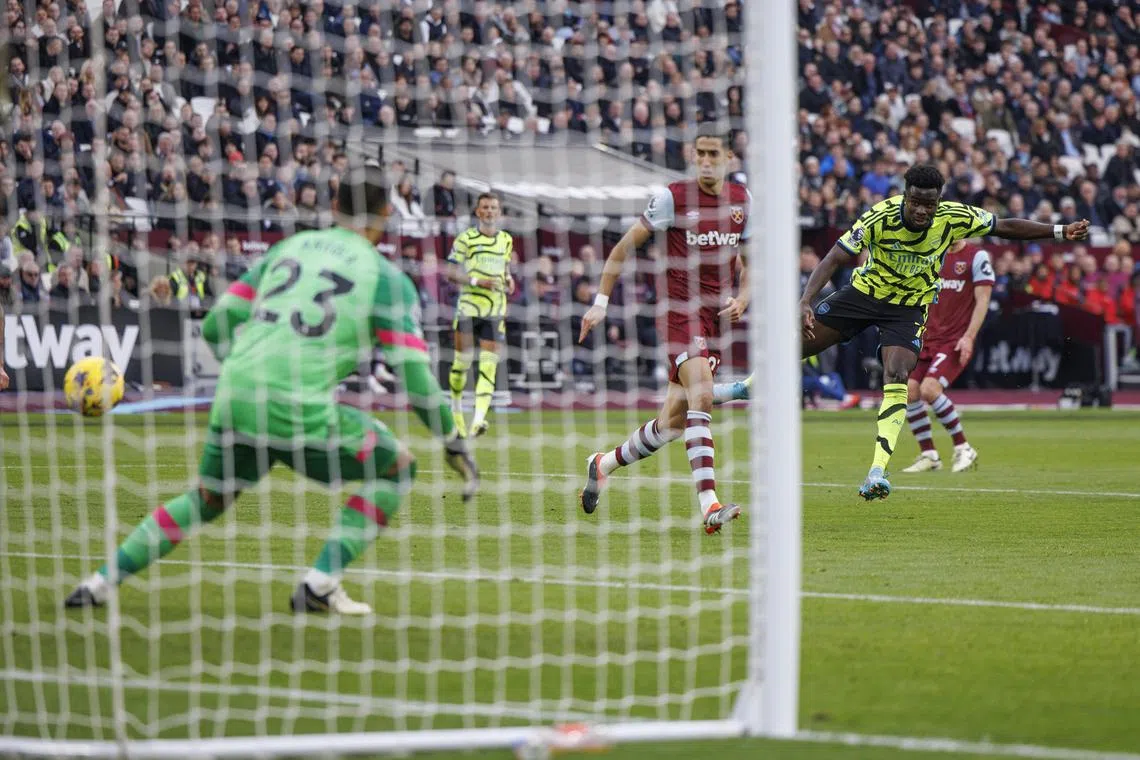 Bukayo Saka scoring his second goal in Arsenal's 6-0 English Premier League win over West Ham United at the London Stadium on Feb 11. 