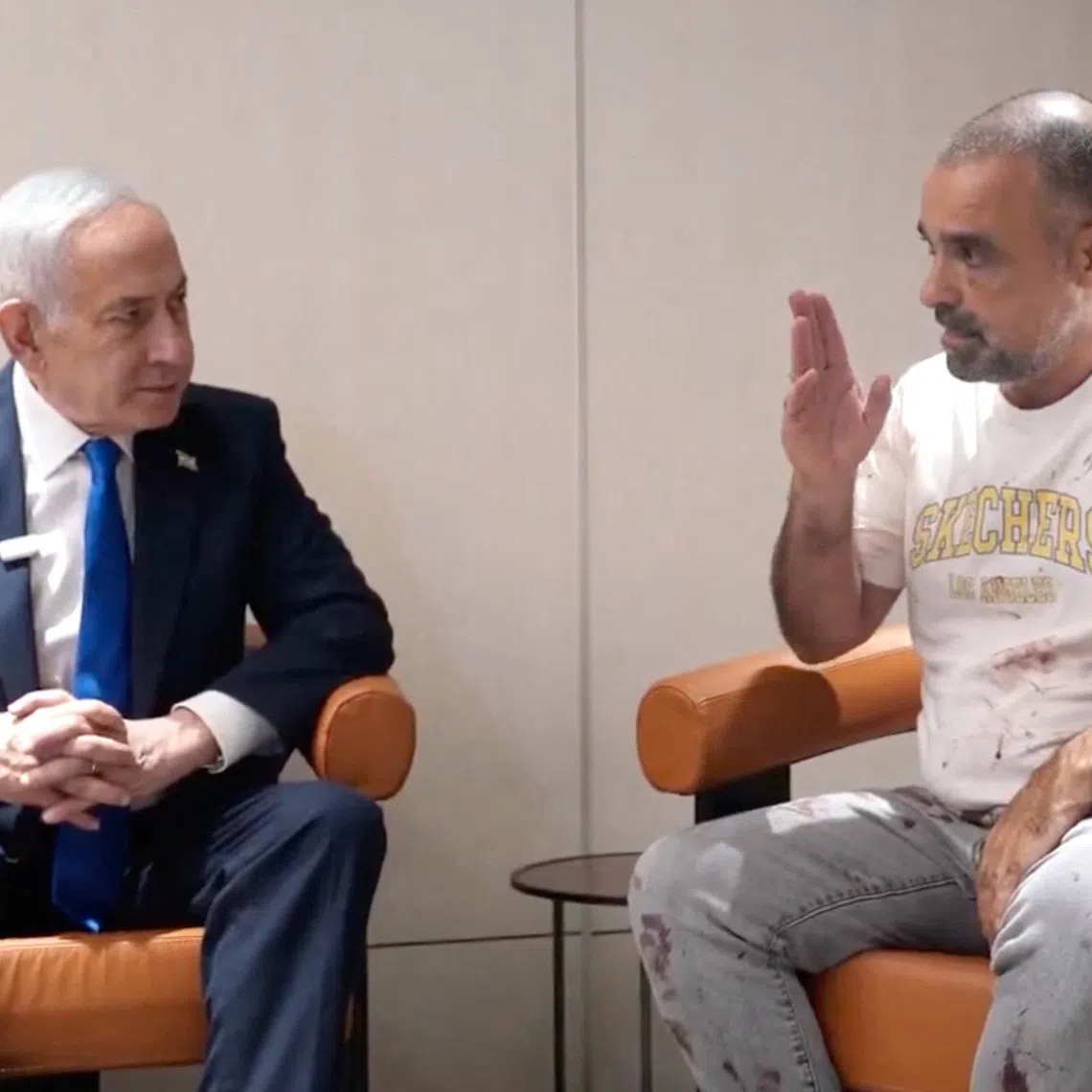 Israeli Prime Minister Benjamin Netanyahu meets Yaniv Hayun, a passenger on the flydubai flight bound for Israel from the United Arab Emirates on Oct 1.