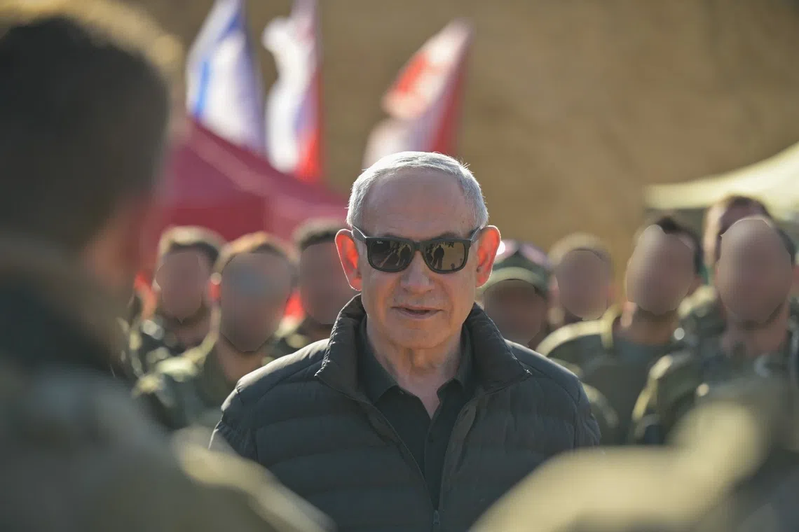 Israeli Prime Minister Benjamin Netanyahu visiting troops at a buffer zone inside Syria on Nov 19, in a photo released by his office.