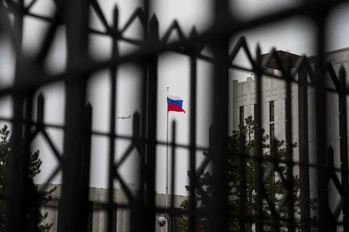 The Russian flag flies above the Embassy of the Russian Federation, near the Glover Park neighborhood of Washington, U.S., February 22, 2022. REUTERS/Tom Brenner/File Photo