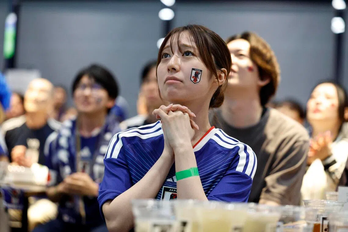 epa13074029 A Japanese soccer team fan reacts during the match of the FIFA World Cup 2026 between Brazil and Japan during a public viewing at ‘blue-ing!’ in Tokyo, Japan, early 30 June 2026.  EPA/FRANCK ROBICHON