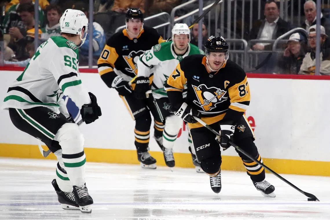 FILE PHOTO: Nov 11, 2024; Pittsburgh, Pennsylvania, USA;  Pittsburgh Penguins center Sidney Crosby (87) skates with the puck as Dallas Stars defenseman Thomas Harley (55) defends during the third period at PPG Paints Arena. Mandatory Credit: Charles LeClaire-Imagn Images/File Photo
