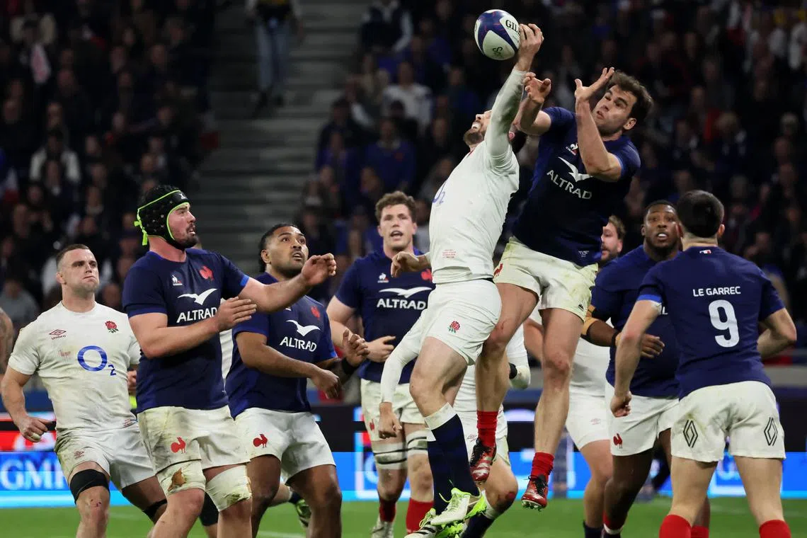 Rugby Union - Six Nations Championship - France v England - Groupama Stadium, Lyon, France - March 16, 2024 France's Damian Penaud in action with England's Elliot Daly REUTERS/Denis Balibouse