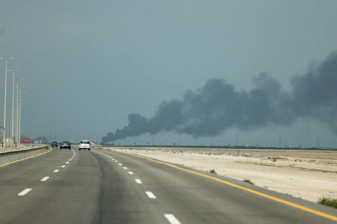 FILE PHOTO: Smoke billows from Saudi Aramco's Ras Tanura oil refinery after a reported Iranian drone strike, amid the U.S.-Israel conflict with Iran, in Ras Tanura, Saudi Arabia, March 2, 2026. REUTERS/Stringer/File Photo