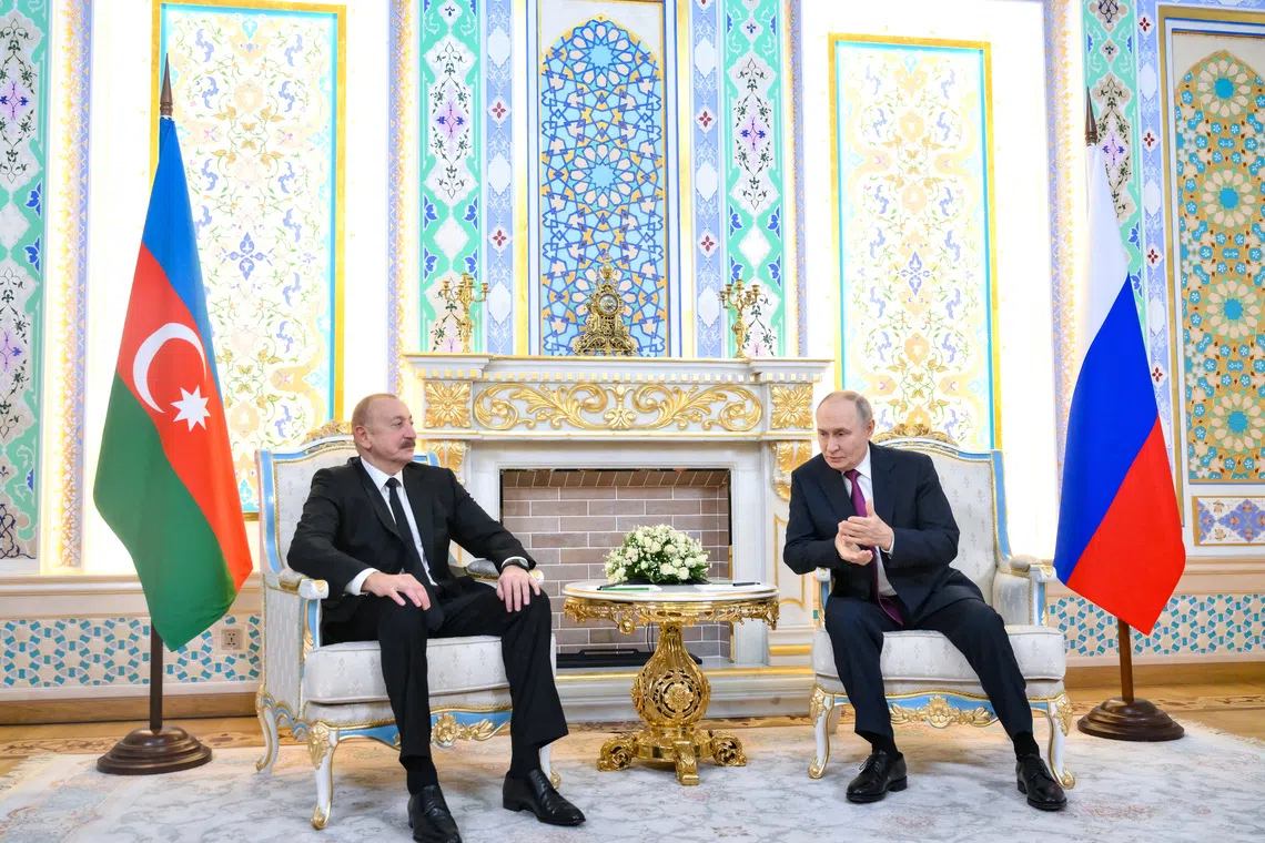 Russian President Vladimir Putin and Azerbaijani President Ilham Aliyev attend a meeting in Dushanbe, Tajikistan October 9, 2025. Sputnik/Grigory Sysoev/Pool via REUTERS