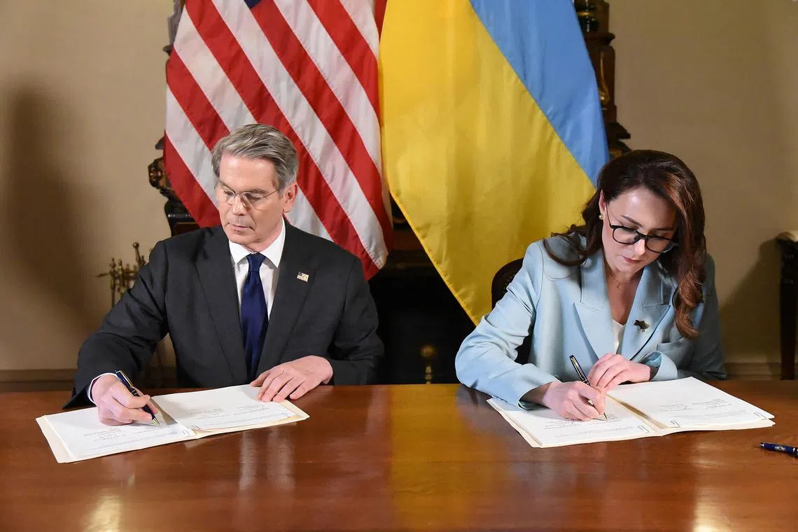 US Treasury Secretary Scott Bessent (left) and Ukrainian Deputy Prime Minister Yulia Svyrydenko signing the deal on April 30. 