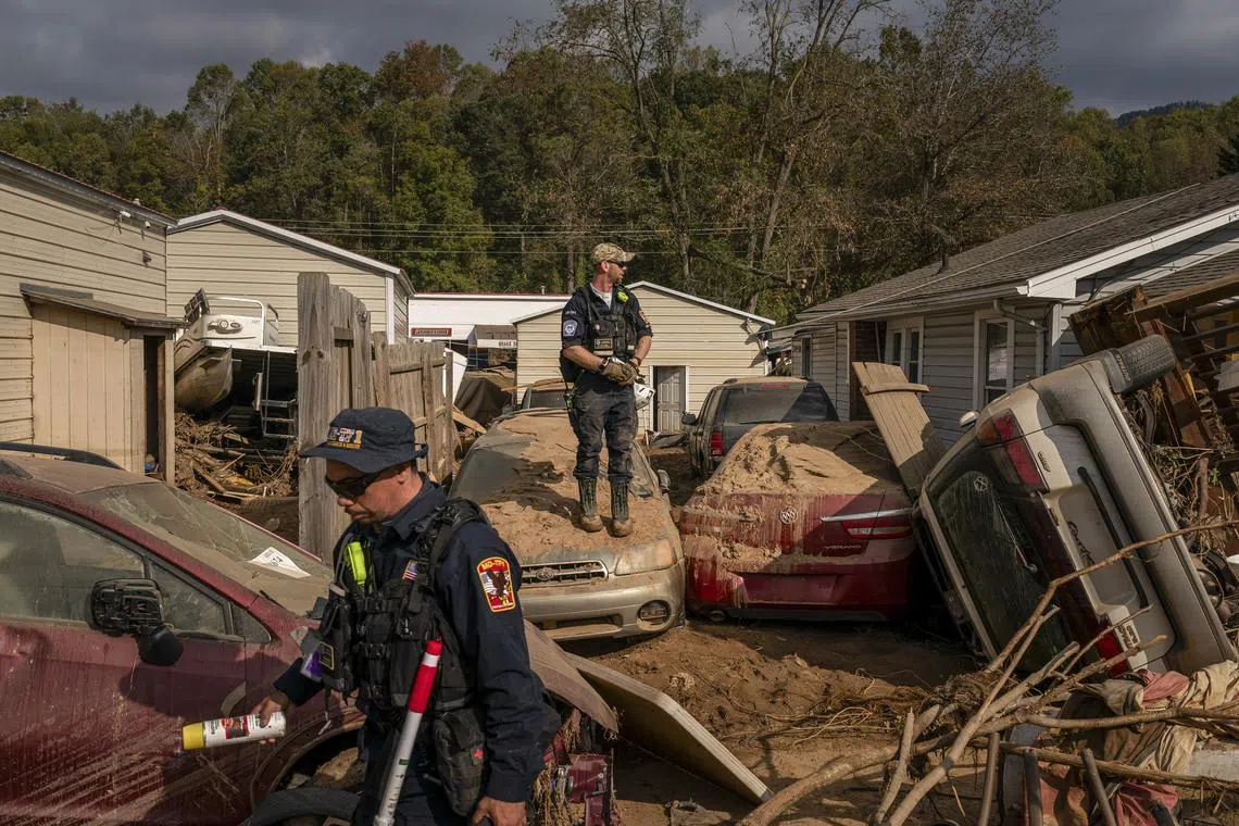 Fema workers look through the wreckage after Hurricane Helene, in Swannanoa, North Carolina.