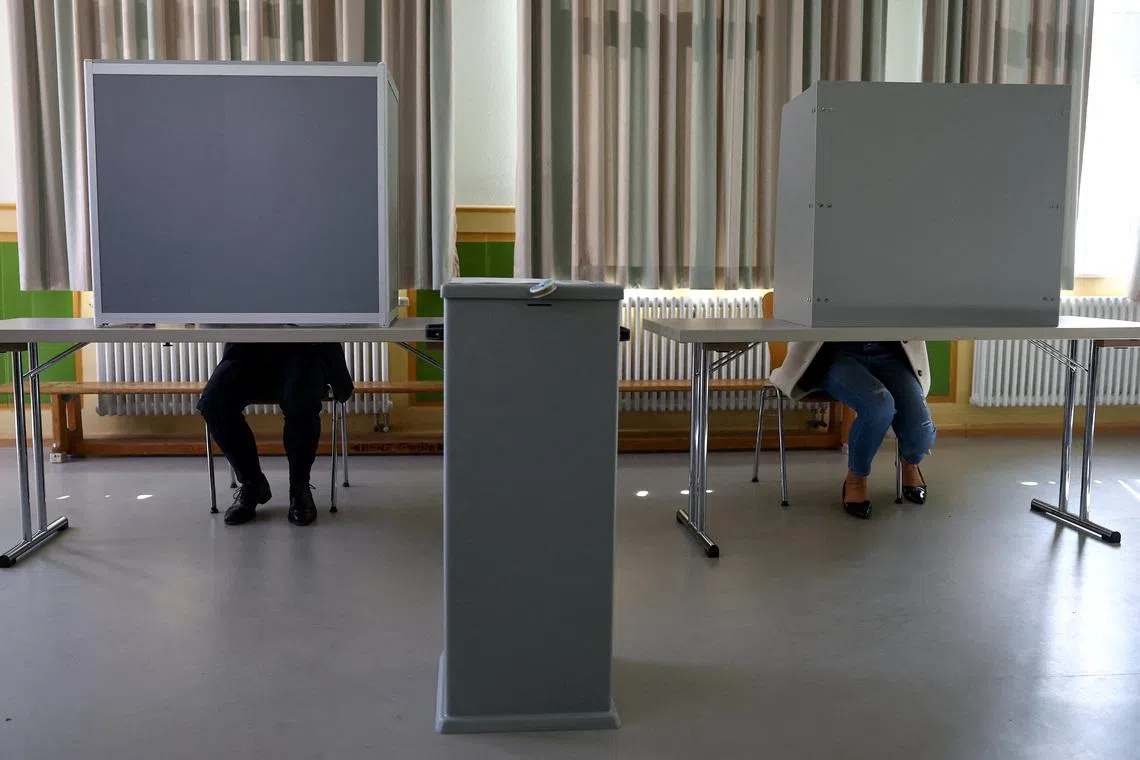 Christian Democratic Union (CDU) top candidate Manuel Hagel and his wife Franziska vote during the Baden-Wuerttemberg state election, at a polling station in Ehingen, near Ulm, Germany, March 8, 2026. REUTERS/Kai Pfaffenbach