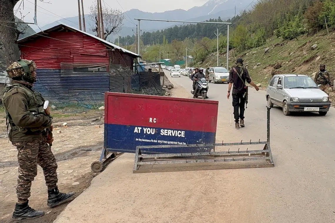 Indian police officers stop vehicles at a check point following a suspected militant attack, near Pahalgam in south Kashmir's Anantnag district, April 22, 2025. REUTERS/Stringer