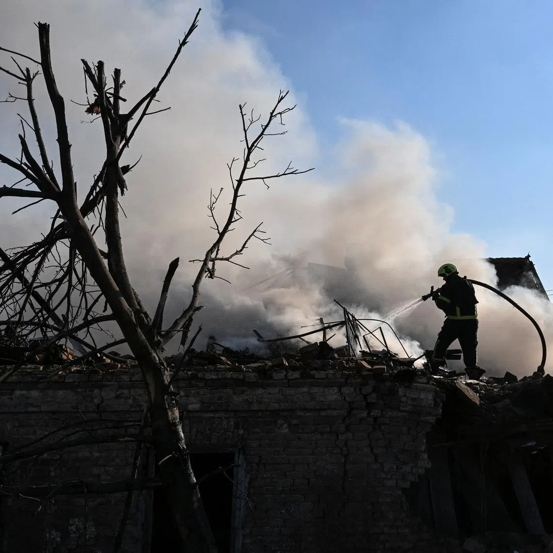 A firefighter works at the site of a Russian air strike, amid Russia's attack on Ukraine, in Zaporizhzhia, Ukraine June 30, 2026. REUTERS/Stringer