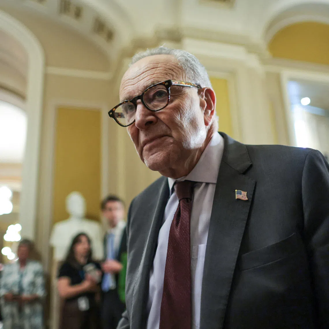 U.S. Senate Minority Leader Chuck Schumer (D-NY) departs after addressing reporters after the weekly Senate Democratic caucus policy luncheon at the U.S. Capitol in Washington, D.C., U.S., December 2, 2025. REUTERS/Jonathan Ernst