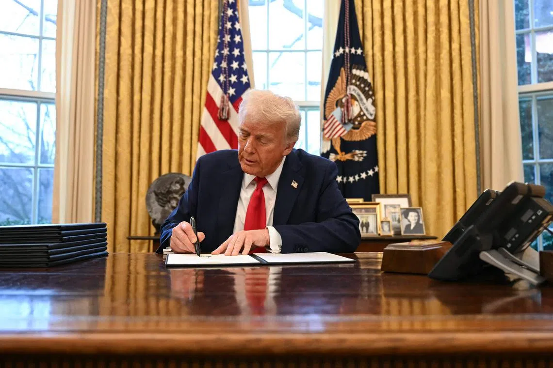 US President Donald Trump signing an executive order to create a US sovereign wealth fund, in the Oval Office of the White House on Feb 3. 
