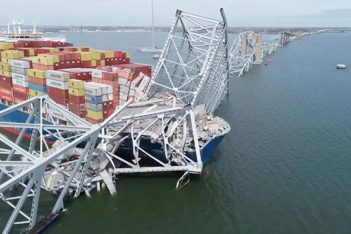 A drone view of the Dali cargo vessel, which crashed into the Francis Scott Key Bridge causing it to collapse, in Baltimore, Maryland, U.S., March 26, 2024, in this still image taken from a handout video. NTSB/Handout via REUTERS THIS IMAGE HAS BEEN SUPPLIED BY A THIRD PARTY. MANDATORY CREDIT