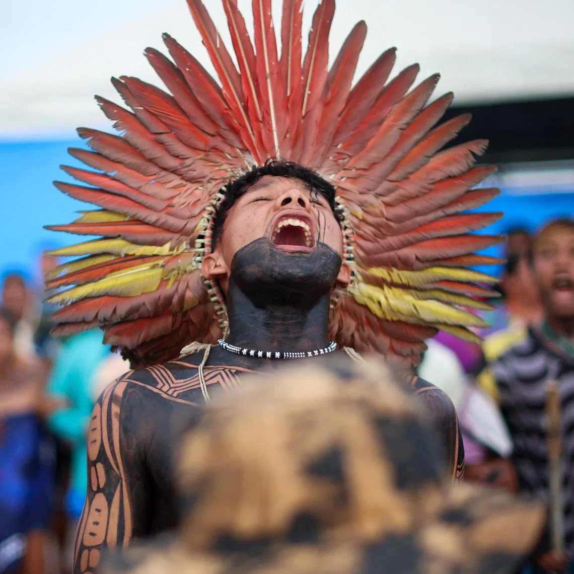 Indigenous people celebrate after Brazilian President Luiz Inacio Lula da Silva’s government revoked Decree 12,600, which allowed plans to dredge the Tapajos River and expand rail transport of soy and corn for export markets, outside Cargill’s Santarem terminal in Santarem, Brazil February 23, 2026. REUTERS/Adriano Machado