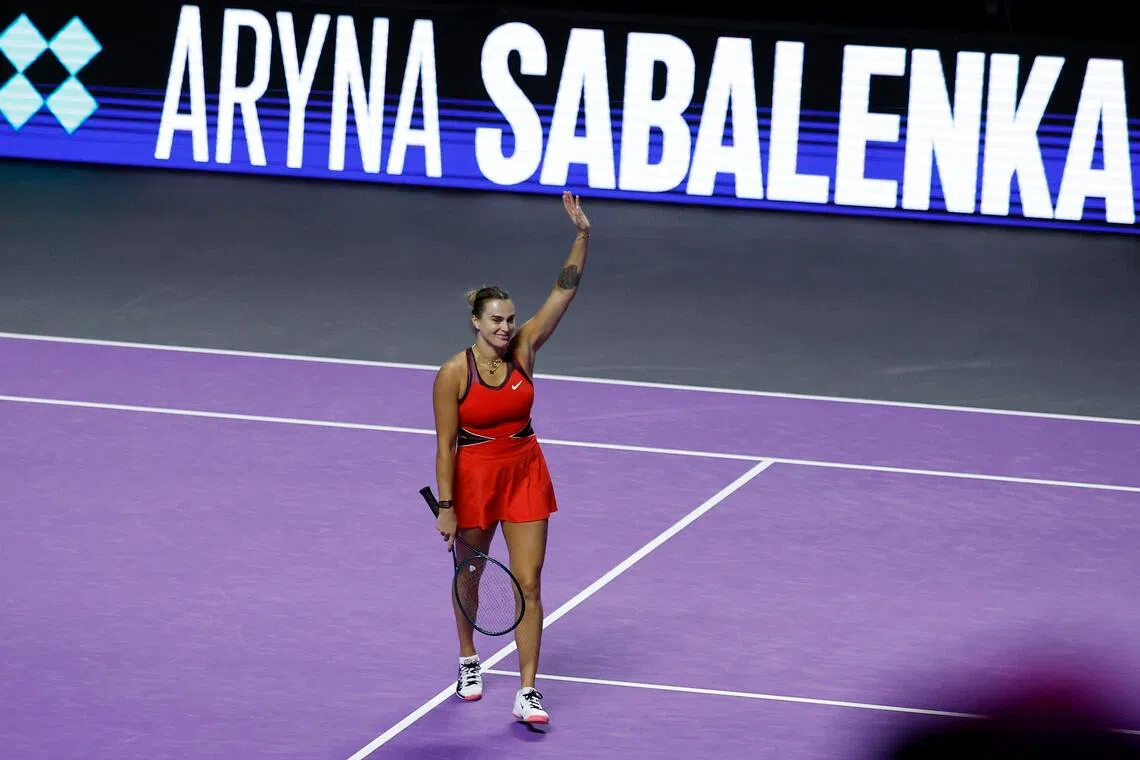 Aryna Sabalenka celebrates winning her group stage match against Coco Gauff of the US.