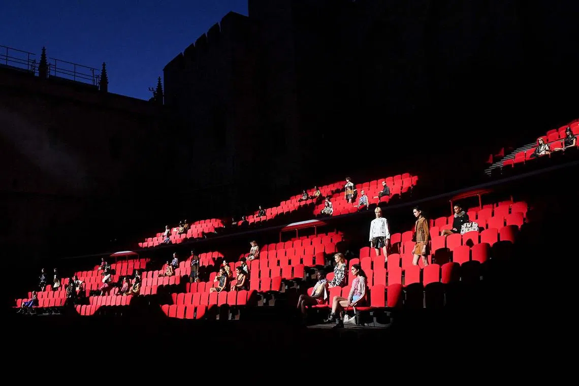 Models presenting creations by designer Nicolas Ghesquiere during the Cruise 2026 collection show for French fashion house Louis Vuitton at the Courtyard of Honour at Palais des Papes in Avignon, France, May 22, 2025. 
