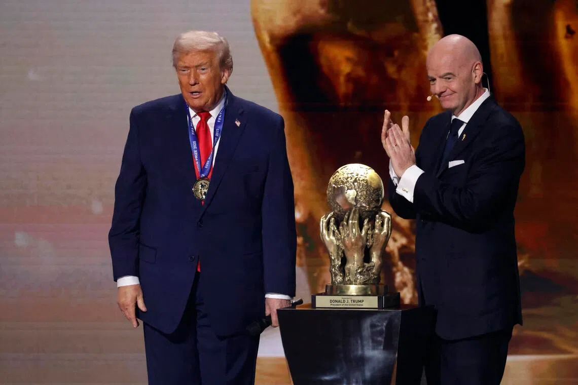 FIFA president Gianni Infantino (right) presenting US President Donald Trump with the FIFA Peace Prize, during the FIFA World Cup 2026 Final Draw in December 2025.
