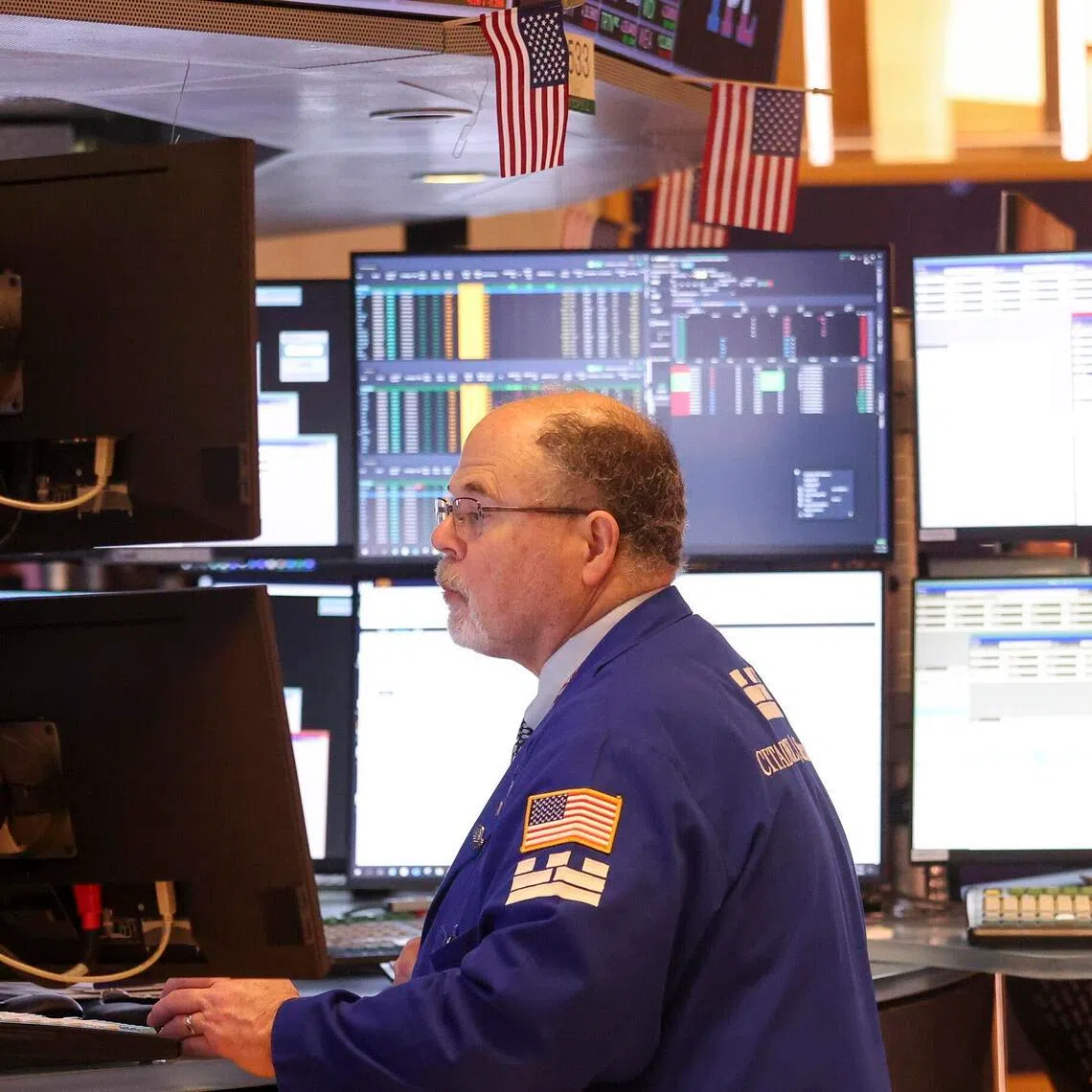 Traders work on the floor of the New York Stock Exchange in New York City on Jan 14.