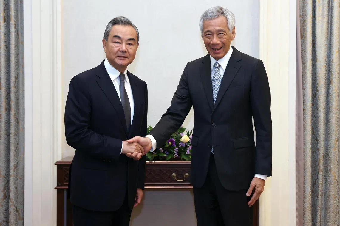 Singapore Prime Minister Lee Hsien Loong (right) met visiting Chinese Foreign Minister Wang Yi at the Istana on Friday.