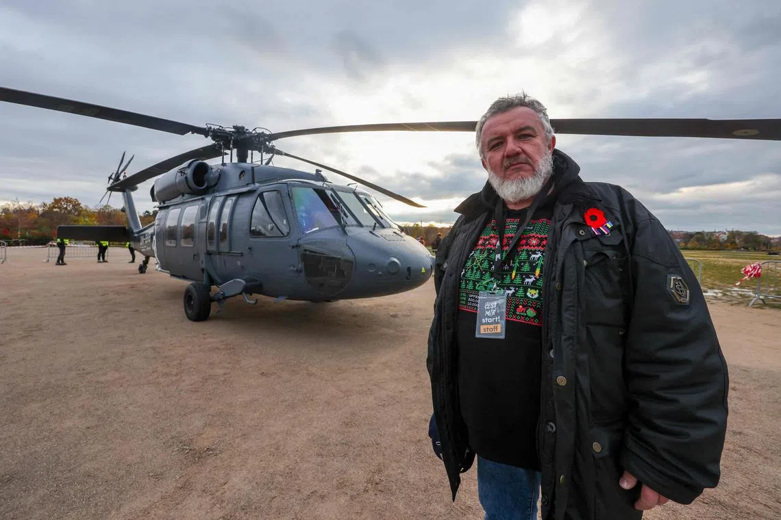 Campaign head Martin Ondracek poses in front of a Black Hawk helicopter - the next target of the pro-Ukraine Gift For Putin initiative.