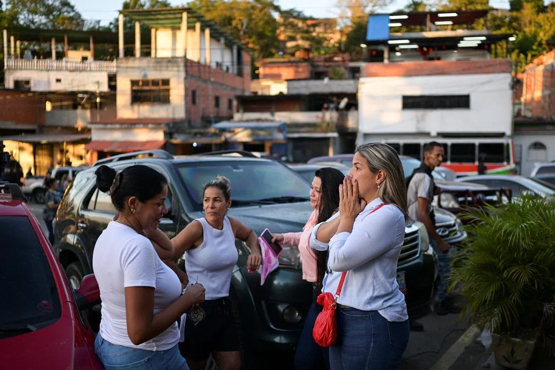 Women gather outside El Rodeo jail after Venezuela's National Assembly President Jorge Rodriguez announced that a significant number of both foreign and Venezuelan prisoners will be freed, in El Rodeo, Miranda state, Venezuela January 8, 2026. REUTERS/Gaby Oraa
