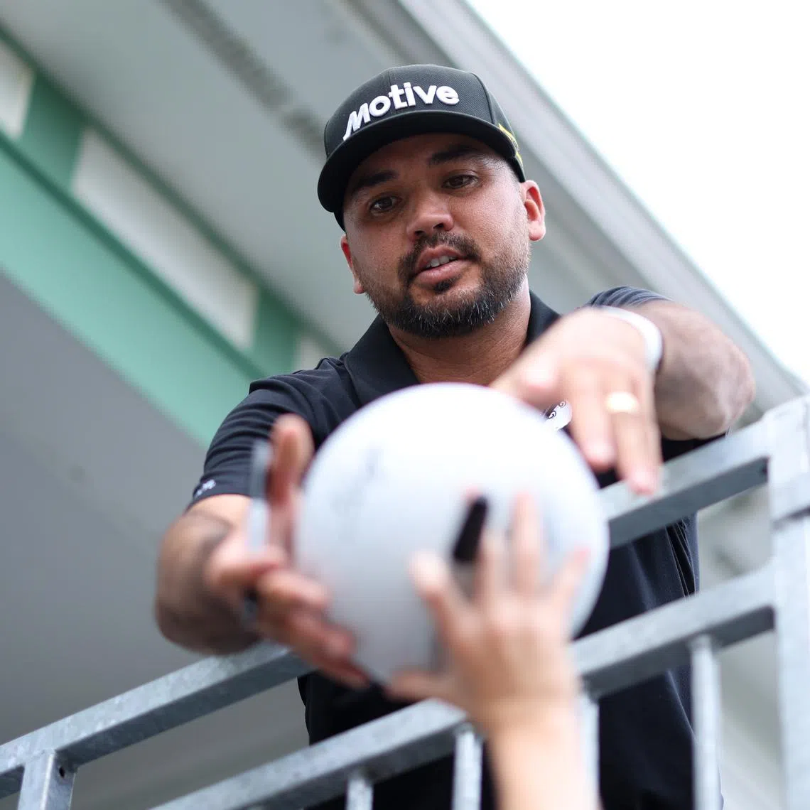 Jun 9, 2025; Oakmont, Pennsylvania, USA; Jason Day signs an autograph during a practice round for the U.S. Open golf tournament at Oakmont Country Club. Mandatory Credit: Bill Streicher-Imagn Images