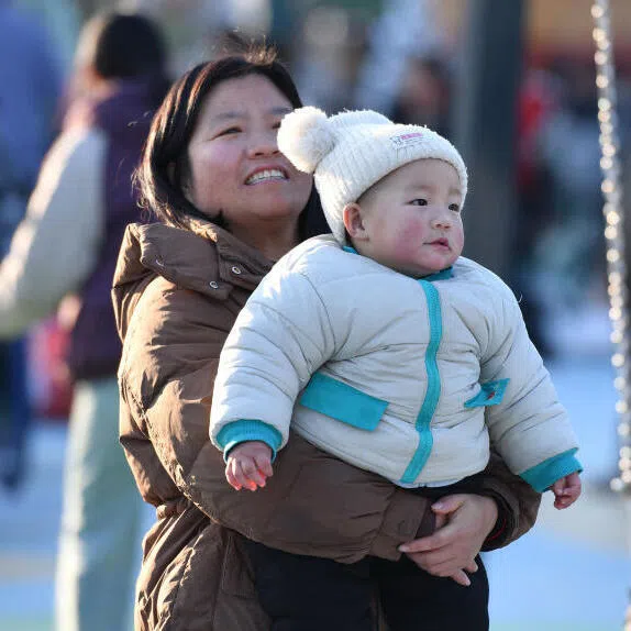 China is throwing money at encouraging more births but money alone may not be enough to persuade parents to go beyond one bouncing bundle of joy. 