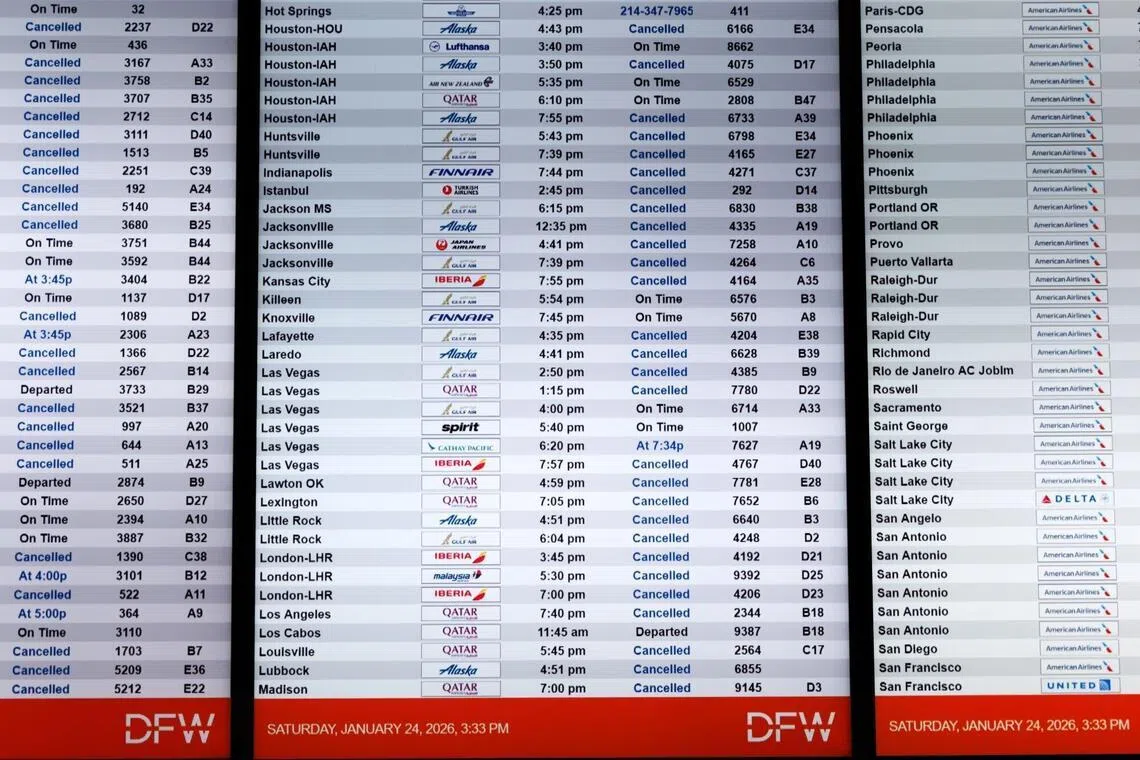 A flight information board at Dallas-Fort Worth International Airport on Jan 24.