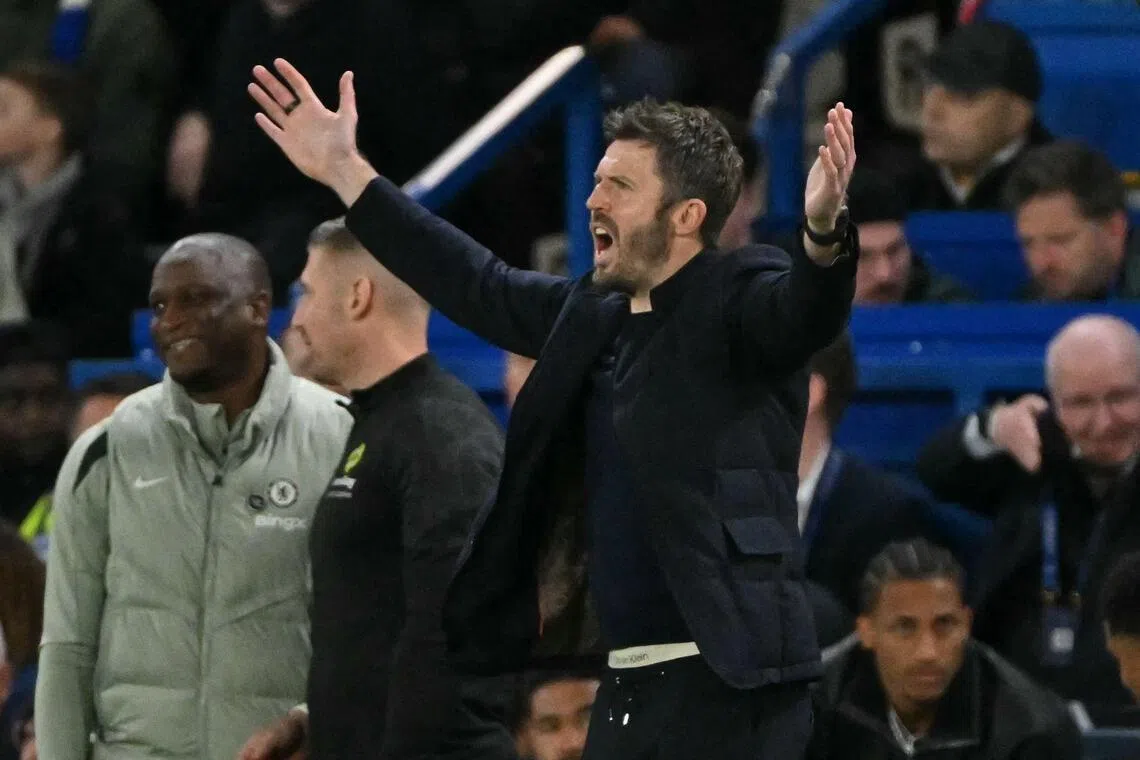 Manchester United's English interim manager Michael Carrick gesturing on the touchline during the 1-0 English Premier League win over Chelsea at Stamford Bridge in London on April 18, 2026.