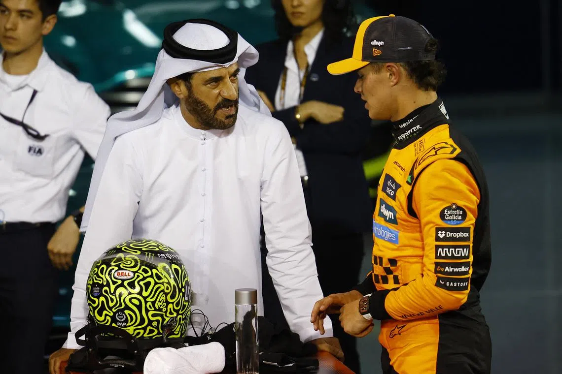 Formula One F1 - Bahrain Grand Prix - Bahrain International Circuit, Sakhir, Bahrain - April 13, 2025 FIA President Mohammed Ben Sulayem with third placed McLaren's Lando Norris after the Bahrain Grand Prix REUTERS/Rula Rouhana/File Photo