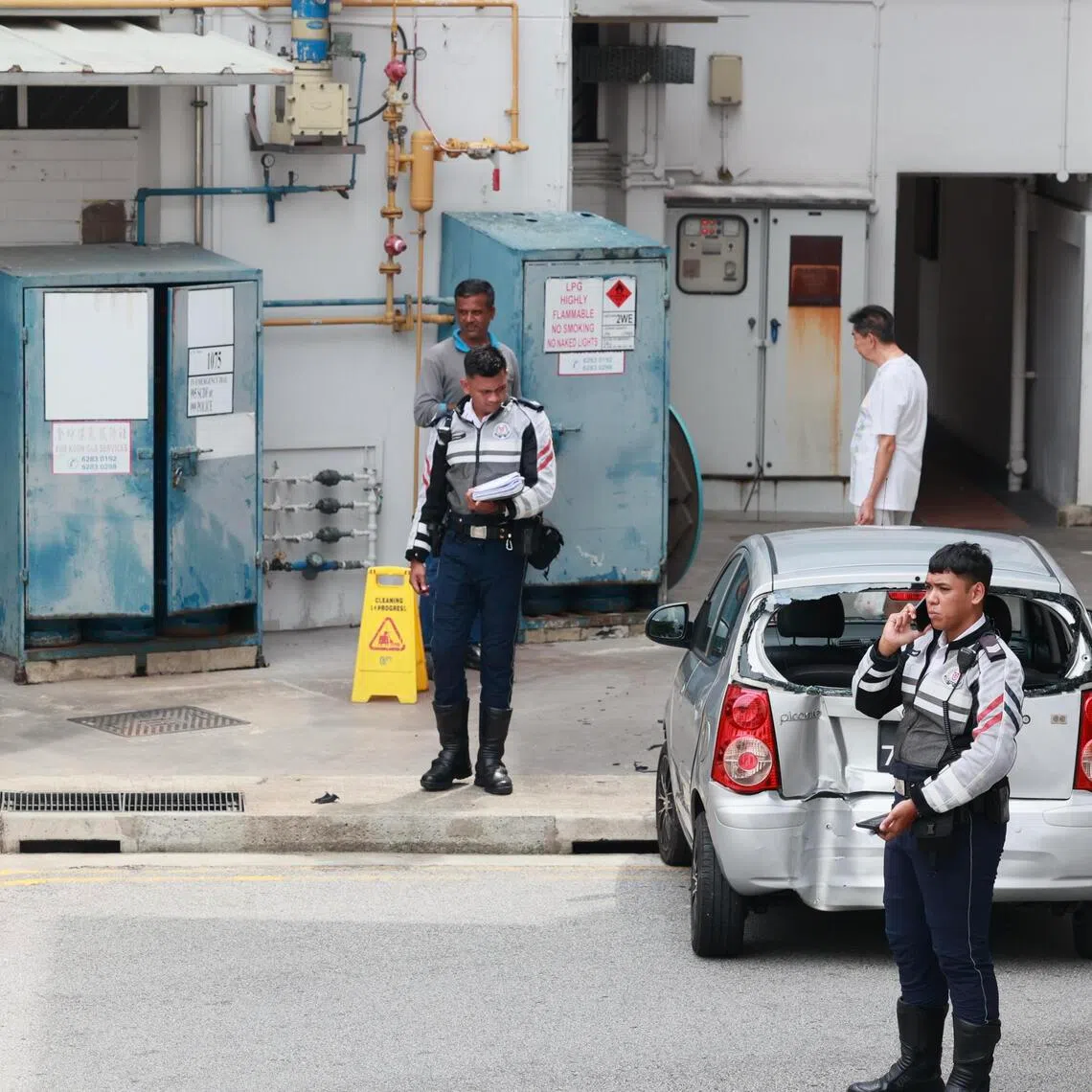 Police officers at the scene of the car accident in Bishan in 2023. Loh Chun Meng was sentenced to two weeks’ jail, fined $2,000 and banned from driving for two years.