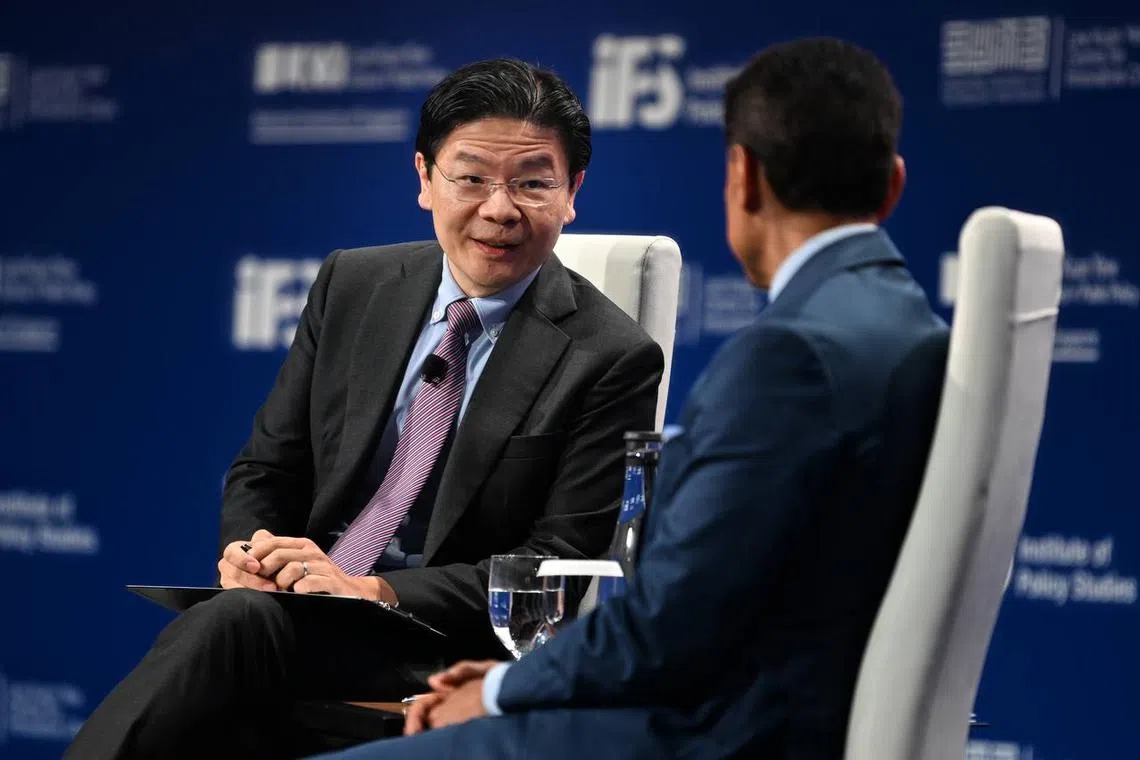 DPM Lawrence Wong speaking at a dialogue at the Reinventing Destiny conference, moderated by Dr Fareed Zakaria, the host of CNN’s weekly show Fareed Zakaria GPS.