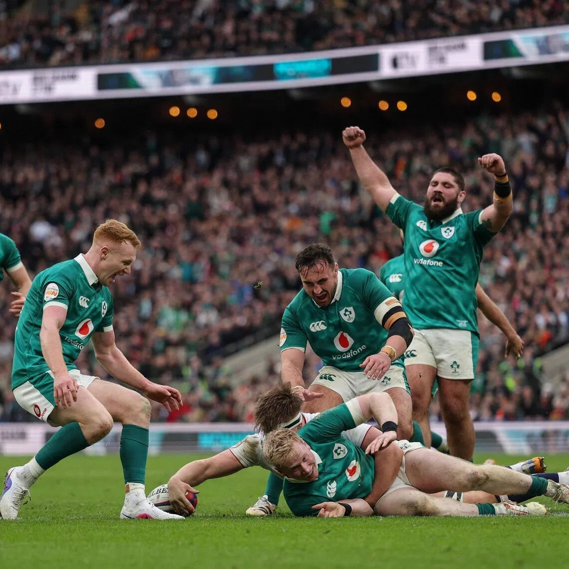 Ireland fullback Jamie Osborne (on the ground) going over the line to score a try during the 42-21 Six Nations' win over England at Twickenham in London on Feb 21, 2026.