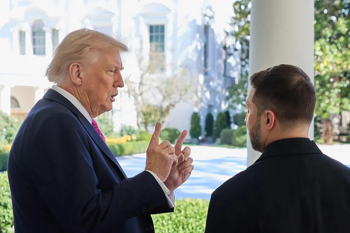 US President Donald Trump (left) speaking to Ukrainian President Volodymyr Zelensky at the White House on Oct 17. 