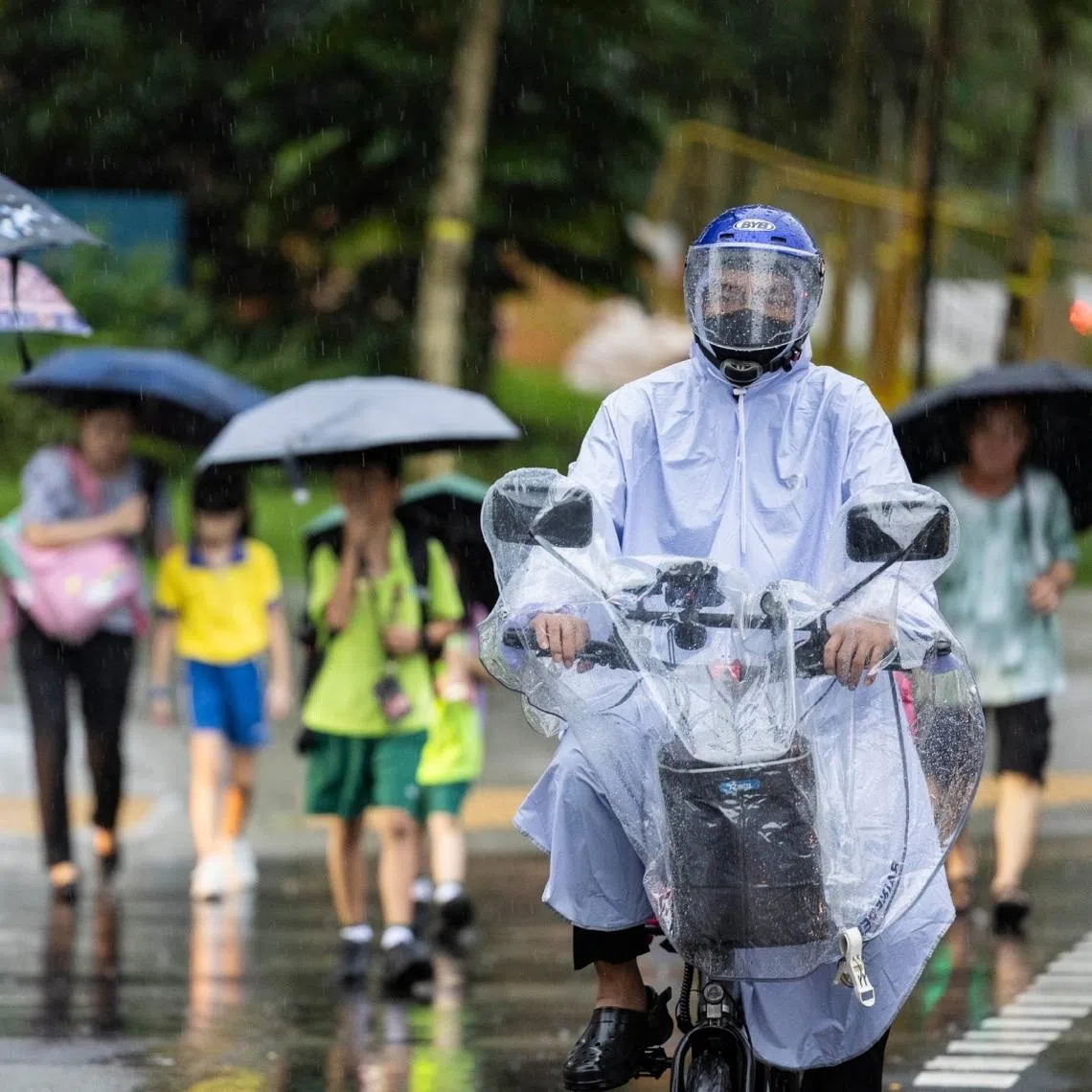 Passers-by walking in the rain at Clementi on Jan 10, 2025.