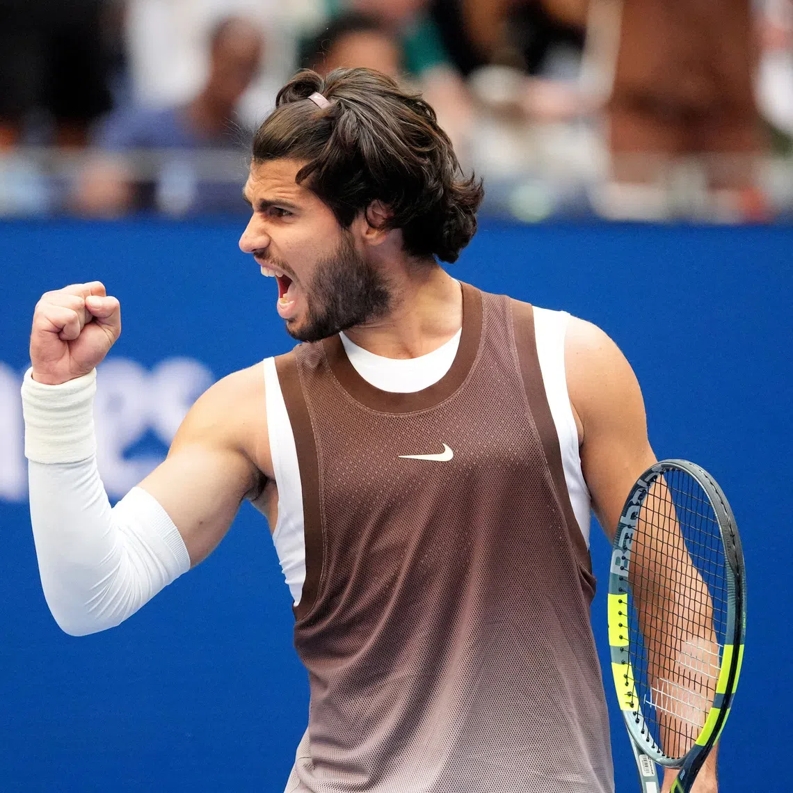Spain’s Carlos Alcaraz celebrates winning his third-round match against China’s Wu Yibing.