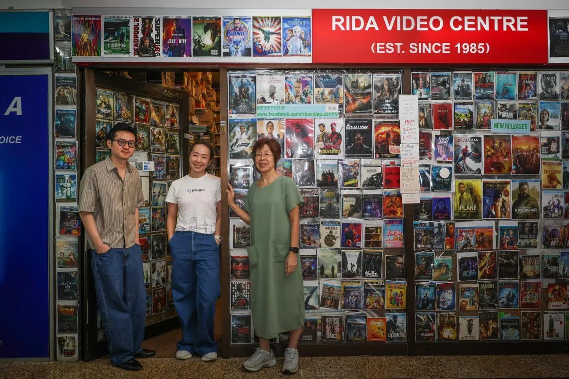 Madam Laurel Khoo (right), co-founder of Rida Video Centre, with her daughter, Ms Lauren Ooi, now employed at a multinational corporation. Ms Ooi worked at Rida Video Centre growing up. With them is Edward Khoo, a film-maker and customer. 