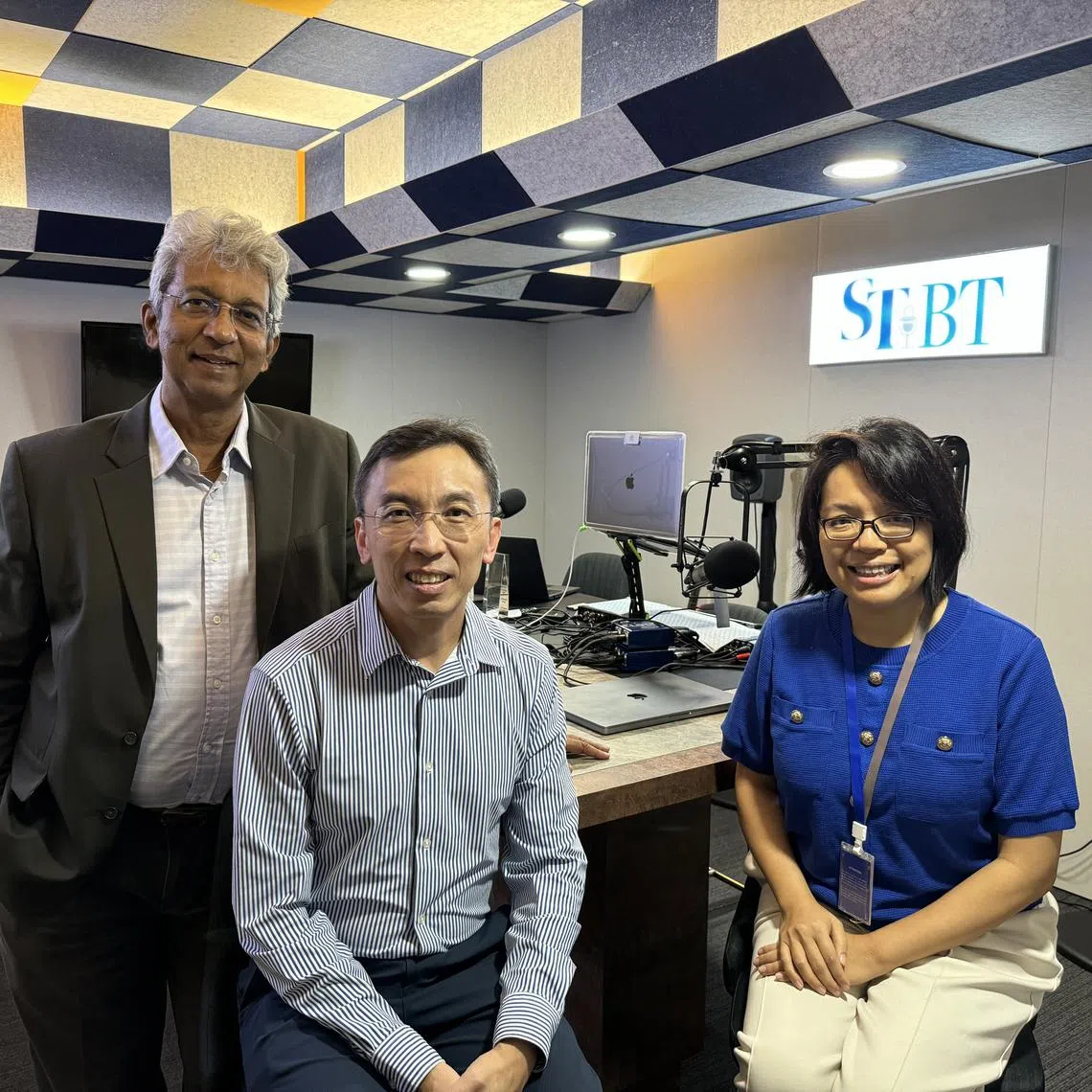 ST's Invest Talk Podcast's guest is CEO and founder of Providend Christopher Tan (centre), flanked by hosts Ven Sreenivasan (left) and Lee Su Shyan (right) in the podcast studio.