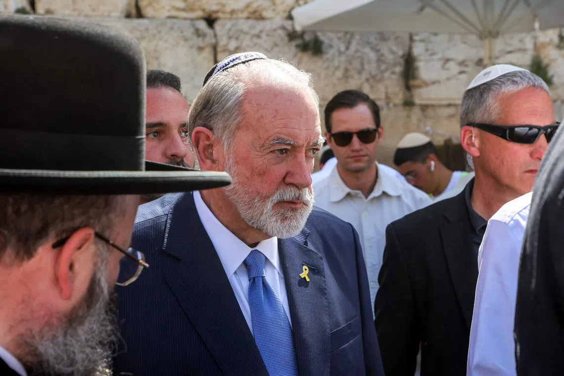 US Ambassador to Israel Mike Huckabee (centre) visiting the Western Wall, the holiest site where Jews are allowed to pray, in the old city of Jerusalem, in April.