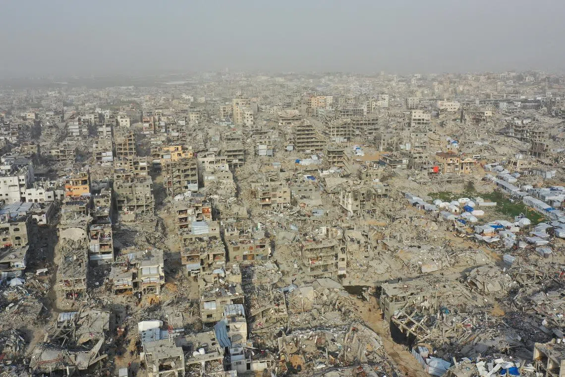 A drone view shows houses destroyed during the Israeli offensive, amid a ceasefire between Israel and Hamas, in Beit Hanoun, northern Gaza Strip.