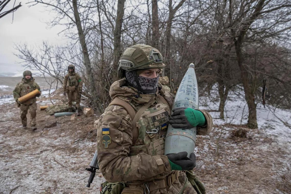 Members of the 3rd Separate Assault Brigade (Azov Unit) of the Armed Forces of Ukraine prepare to fire 152 mm howitzer 2A65 Msta-B, amid Russia's attack on Ukraine, near Bahmut, in Donetsk region, Ukraine, February 6, 2023. REUTERS/Marko Djurica     TPX IMAGES OF THE DAY     
