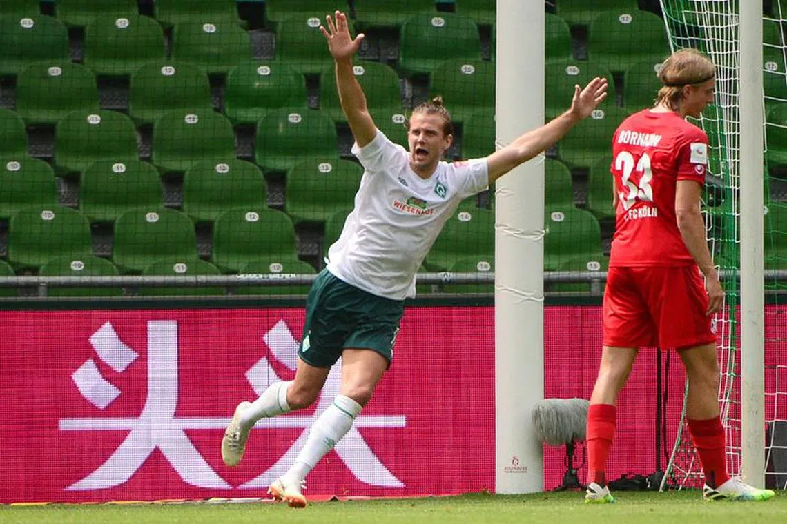 Soccer Football - Bundesliga - Werder Bremen v FC Cologne - Weser-Stadion, Bremen, Germany - June 27, 2020 Bremen's Niclas Fuellkrug celebrates scoring their third goal, following the resumption of play behind closed doors after the outbreak of the coronavirus disease (COVID-19)  Patrik Stollarz/Pool via REUTERS/File Photo