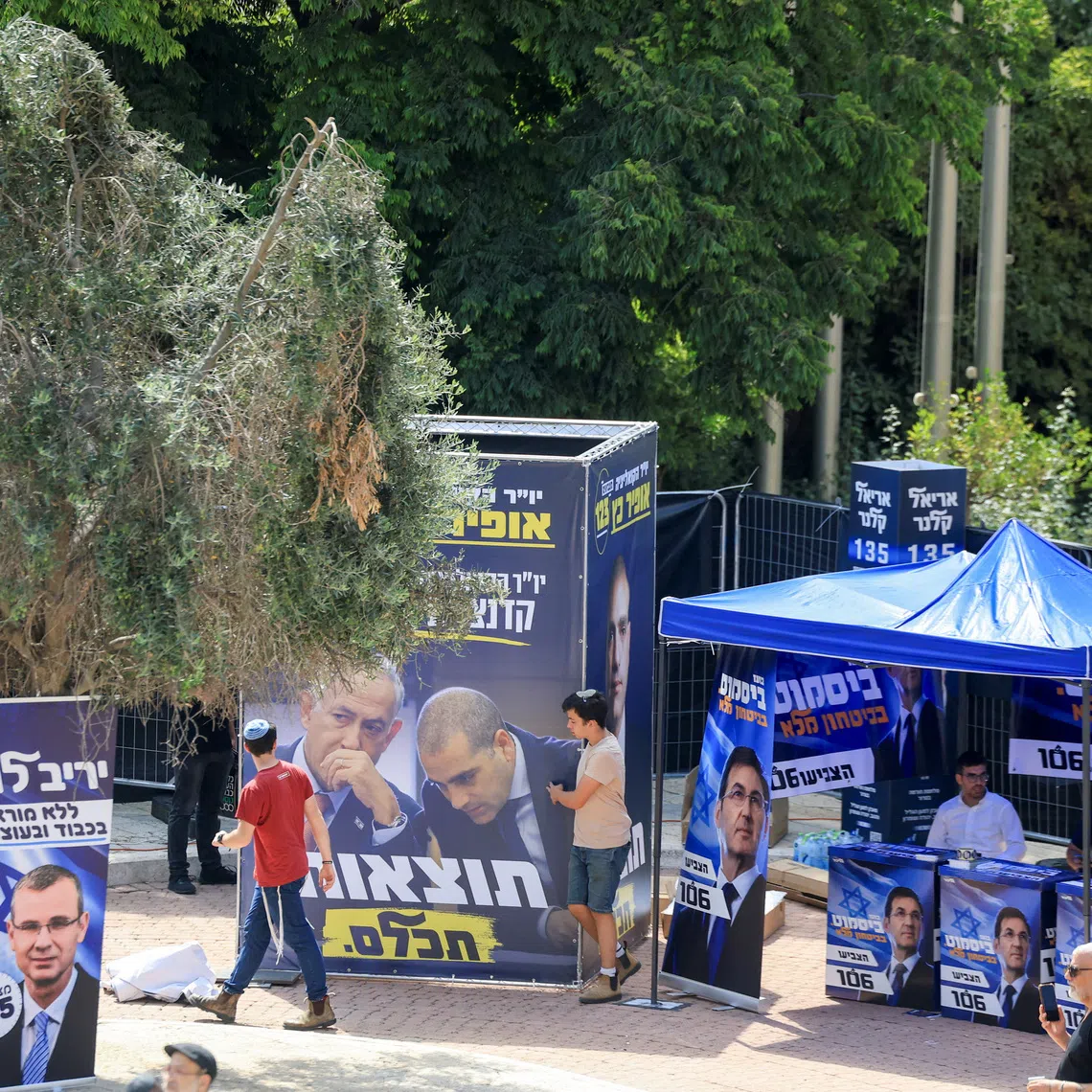 People view stalls and advertisements promoting candidates of the Likud party, led by Israeli Prime Minister Benjamin Netanyahu, on the day of the Likud primaries list vote, ahead of Israel's general election in October, in Jerusalem, August 17, 2026. REUTERS/Ronen Zvulun