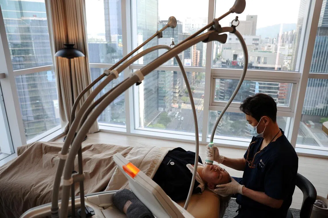 A customer receiving treatment at a skin care clinic in Seoul, South Korea.