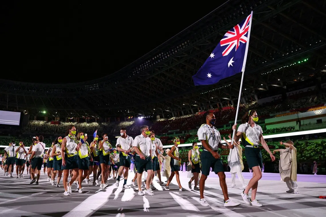 FILE PHOTO: Tokyo 2020 Olympics - The Tokyo 2020 Olympics Opening Ceremony - Olympic Stadium, Tokyo, Japan - July 23, 2021. Flag bearers Cate Campbell of Australia and Patty Mills of Australia lead their contingent during the athletes' parade at the opening ceremony REUTERS/Kai Pfaffenbach/File Photo