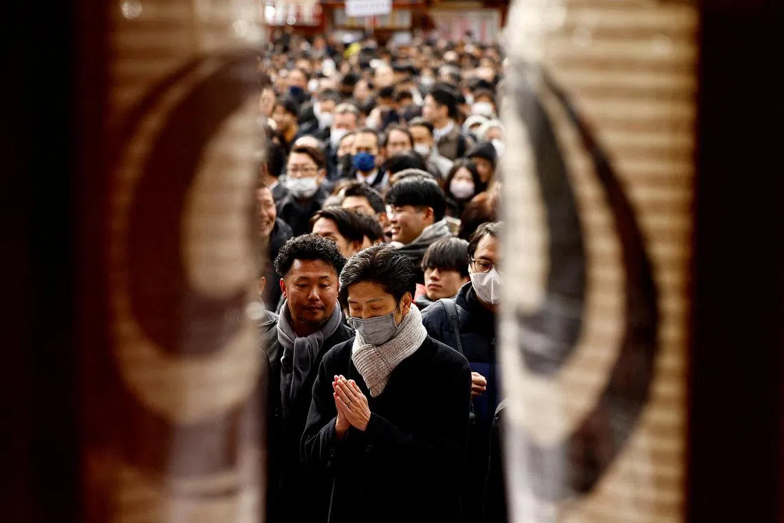 Visitors offer prayers on the first business day of the New Year at the Kanda Myojin shrine, frequented by worshippers seeking good fortune and prosperous business, in Tokyo, Japan, January 6, 2025. REUTERS/Issei Kato TPX IMAGES OF THE DAY