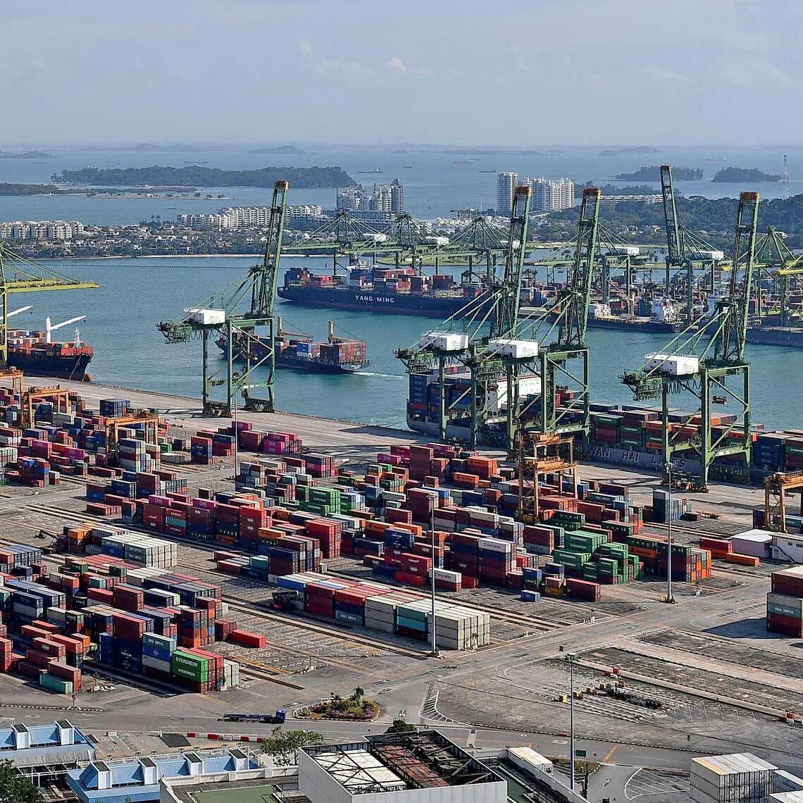 Containers at Tanjong Pagar Terminal, Keppel Terminal, Brani Terminal on Pulau Brani and Sentosa Cove as viewed from The Pinnacle@Duxton on March 4, 2021.