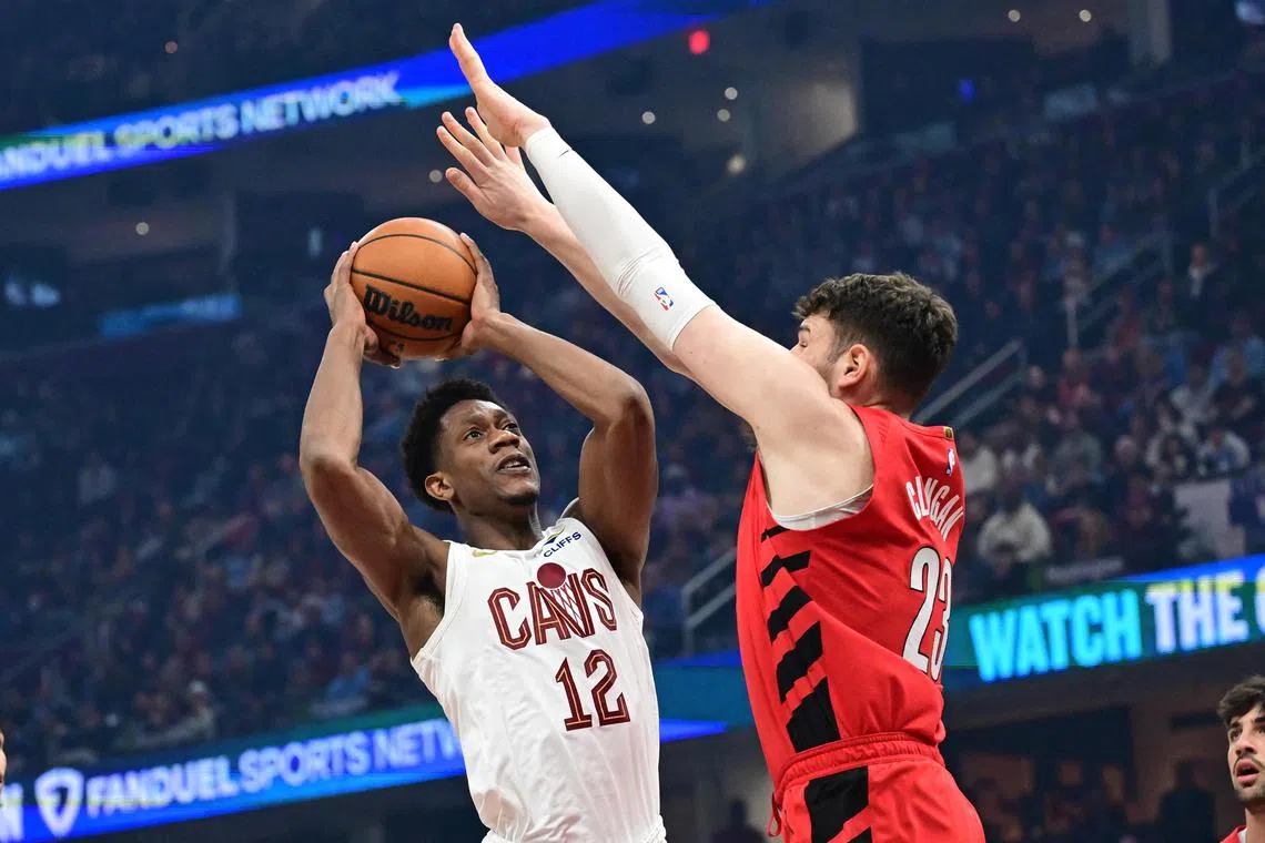 Cleveland Cavaliers forward De'Andre Hunter drives to the basket against Portland Trail Blazers centre Donovan Clingan during the first half at Rocket Arena.