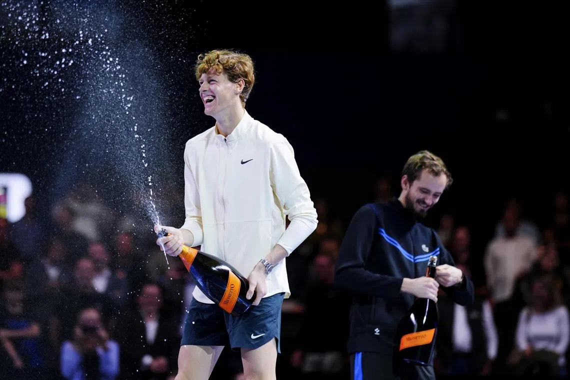 Italy's Jannik Sinner (left) sprays champagne as he celebrates with second placed Russia's Daniil Medvedev.