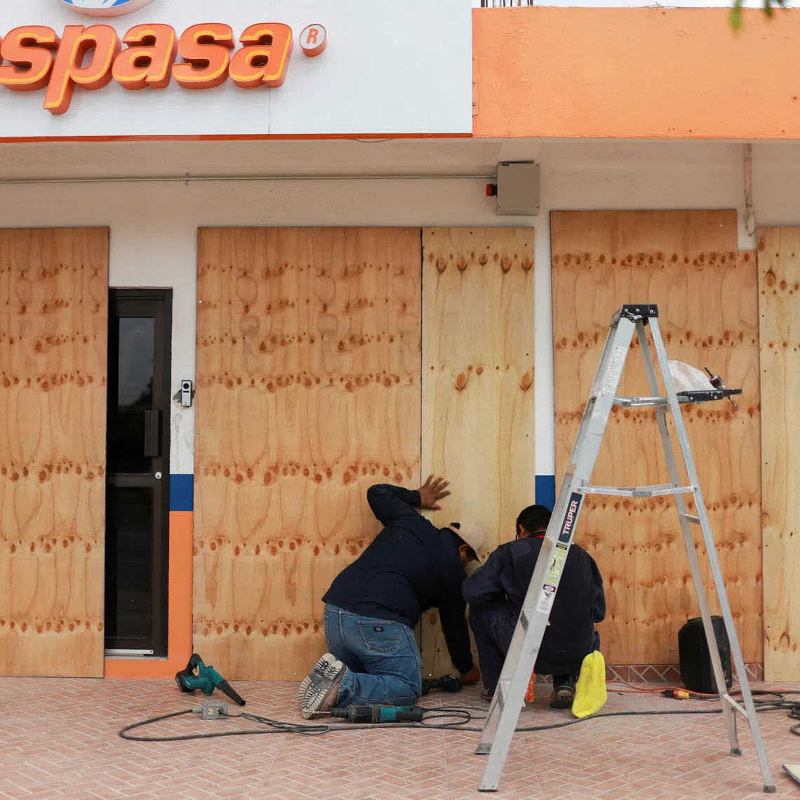 People board up glass windows as Hurricane Polo approaches Baja California Sur, in Ciudad Constitucion, Mexico September 27, 2026. REUTERS/Raquel Cunha